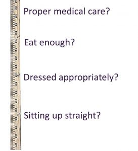 a yardstick marked with the ways people used to judge parents