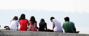 friends sitting on a wall